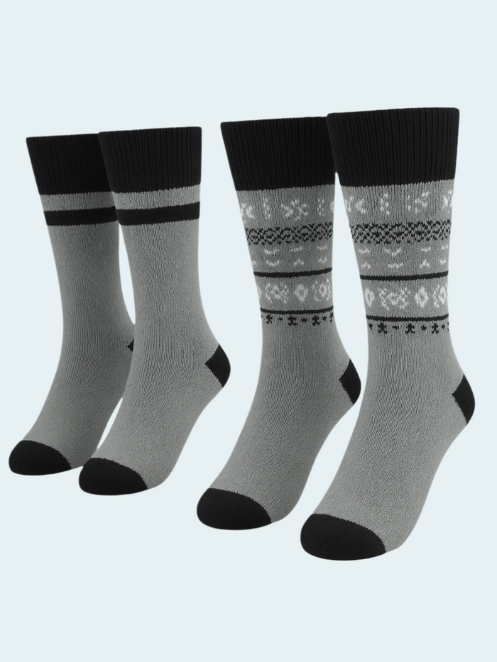 Four pairs of gray socks with black accents on a light gray background