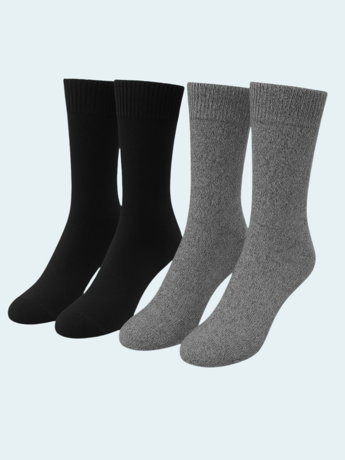 Set of black and gray socks on a light gray background
