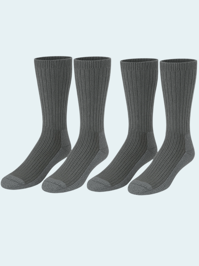 Four pairs of gray socks on a light gray background