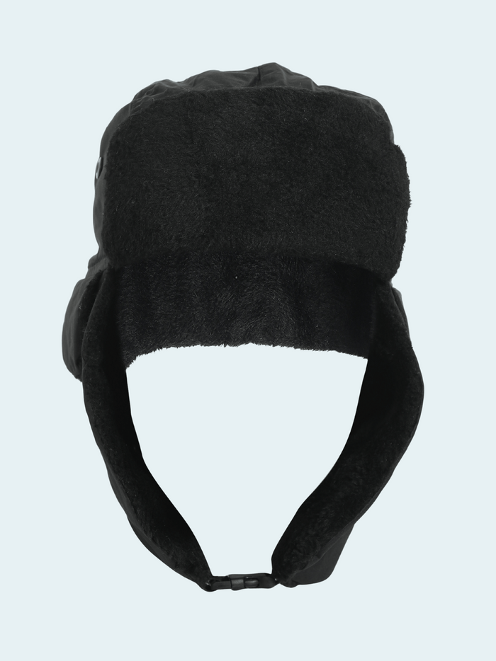 Black winter hat with ear flaps on a light gray background
