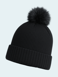 Black knit beanie with a fluffy pom-pom on a light gray background