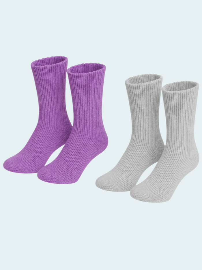 Two pairs of socks, one purple and one gray, on a light gray background.
