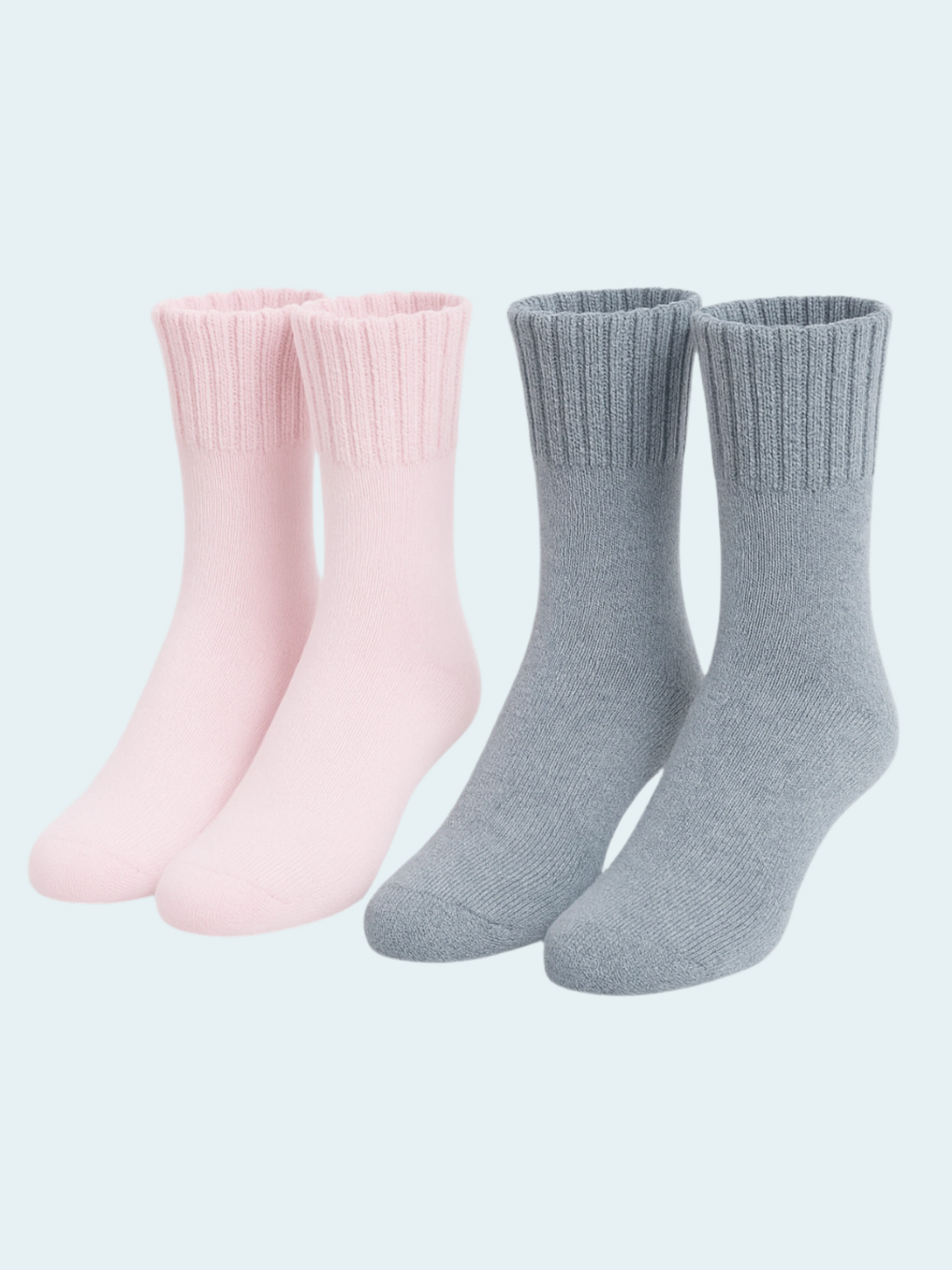 Two pairs of socks, one pink and one gray, on a light gray background.