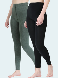 Person wearing green and black leggings on a white background