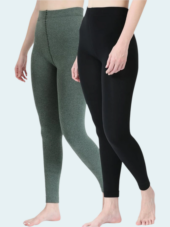 Person wearing green and black leggings on a white background
