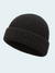 Black knit beanie on a light gray background