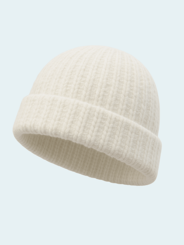 Ivory knit beanie on a light gray background