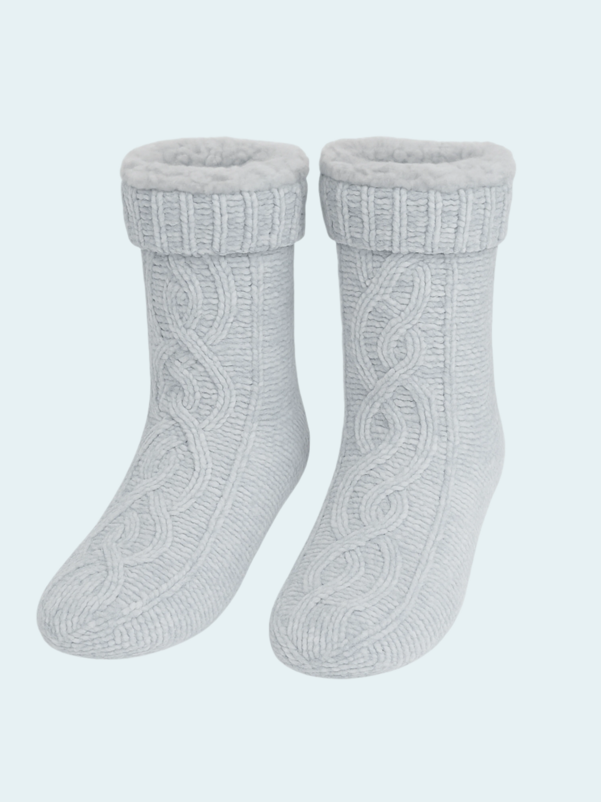 Pair of gray chenille knit socks on a light blue background