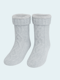 Pair of gray chenille knit socks on a light blue background