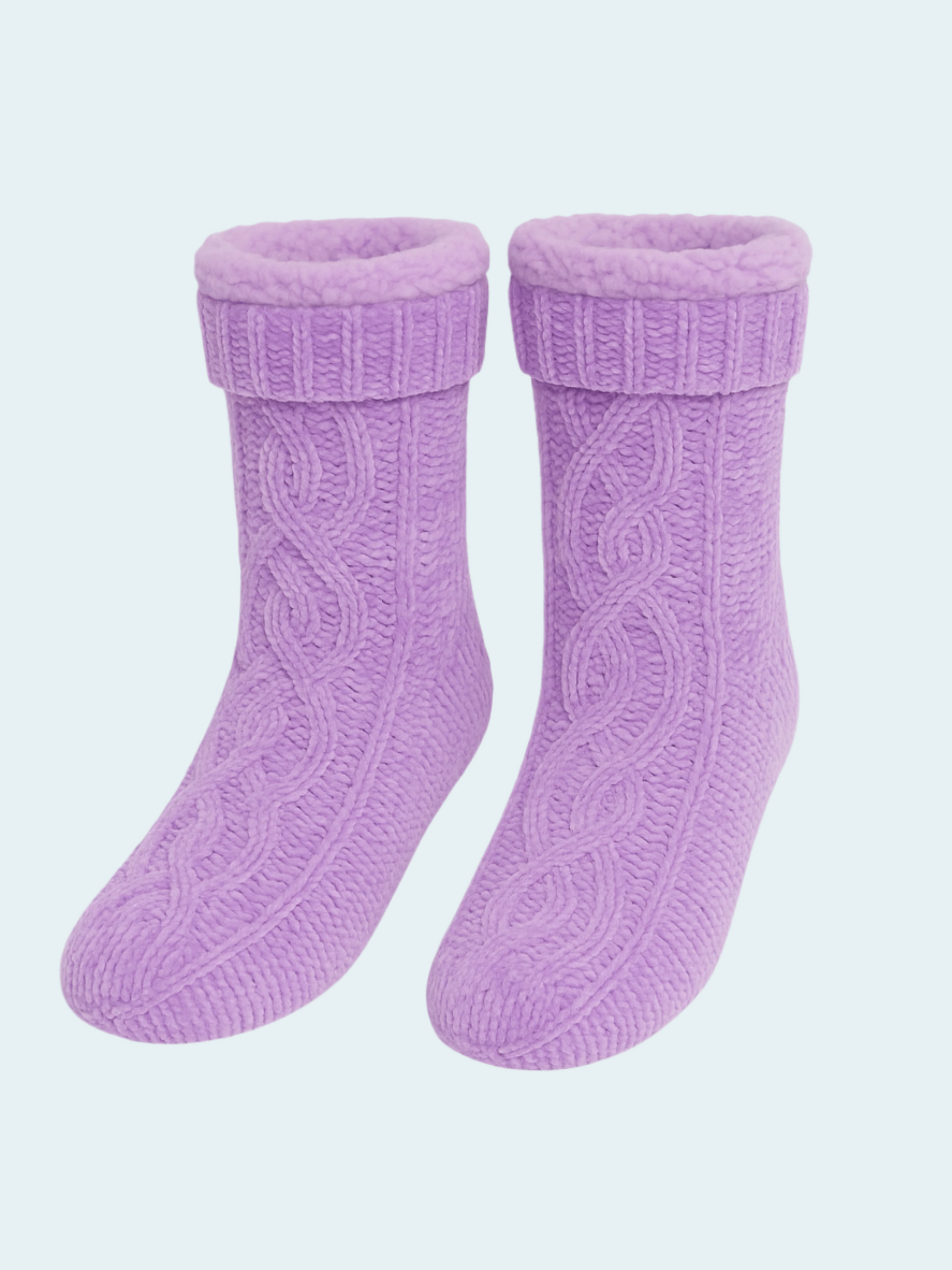 Pair of purple knitted socks on a light purple background