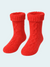 Pair of red knitted chenille socks on a light blue background