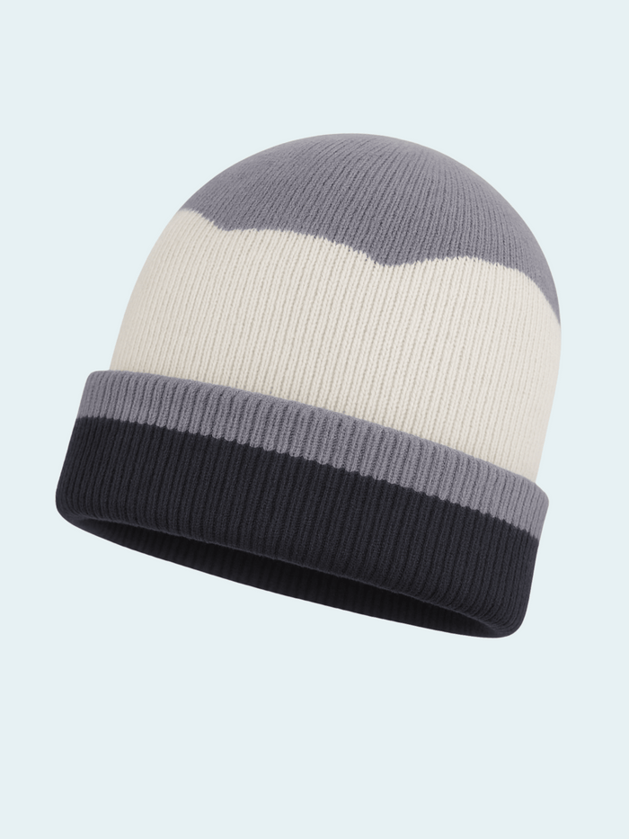 Knitted beanie with gray and white stripes on a light blue background