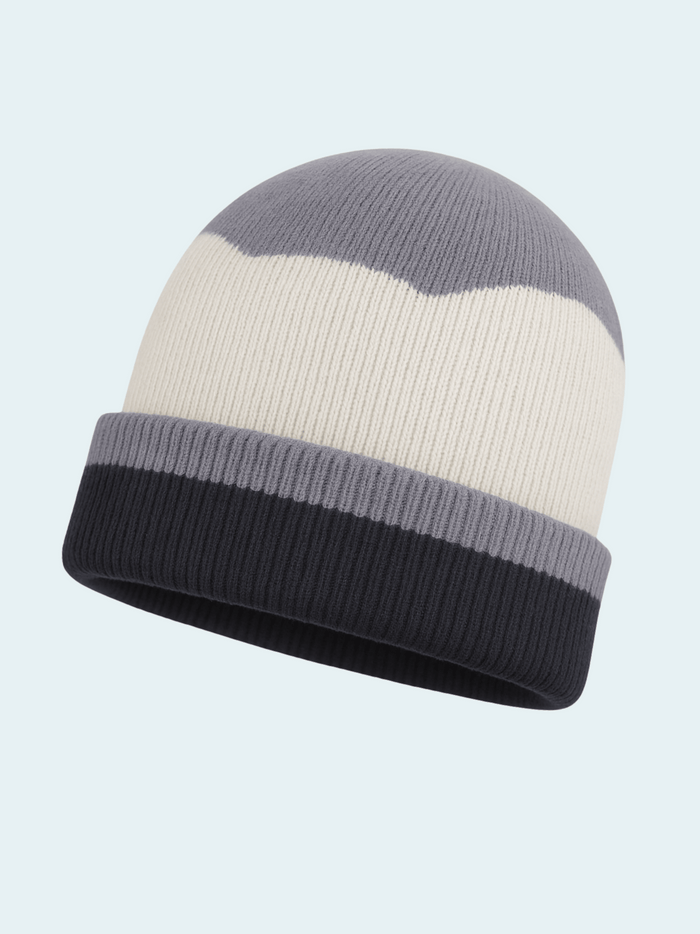 Knitted beanie with gray and white stripes on a light blue background