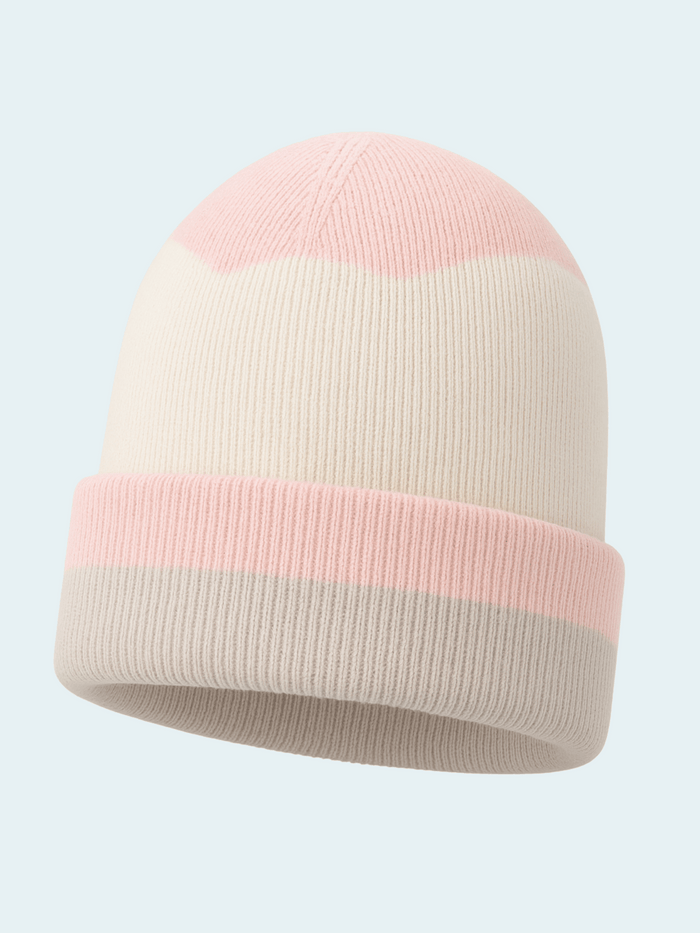 Two-tone pink and beige beanie on a light gray background
