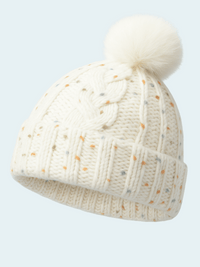 Knitted beanie with a pom-pom on a light gray background
