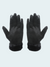 Pair of black gloves with fur cuff on a light gray background