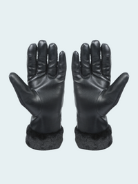 Pair of black leather gloves with fur cuffs on a light gray background