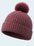 Burgundy knit beanie with a pom-pom on a light gray background