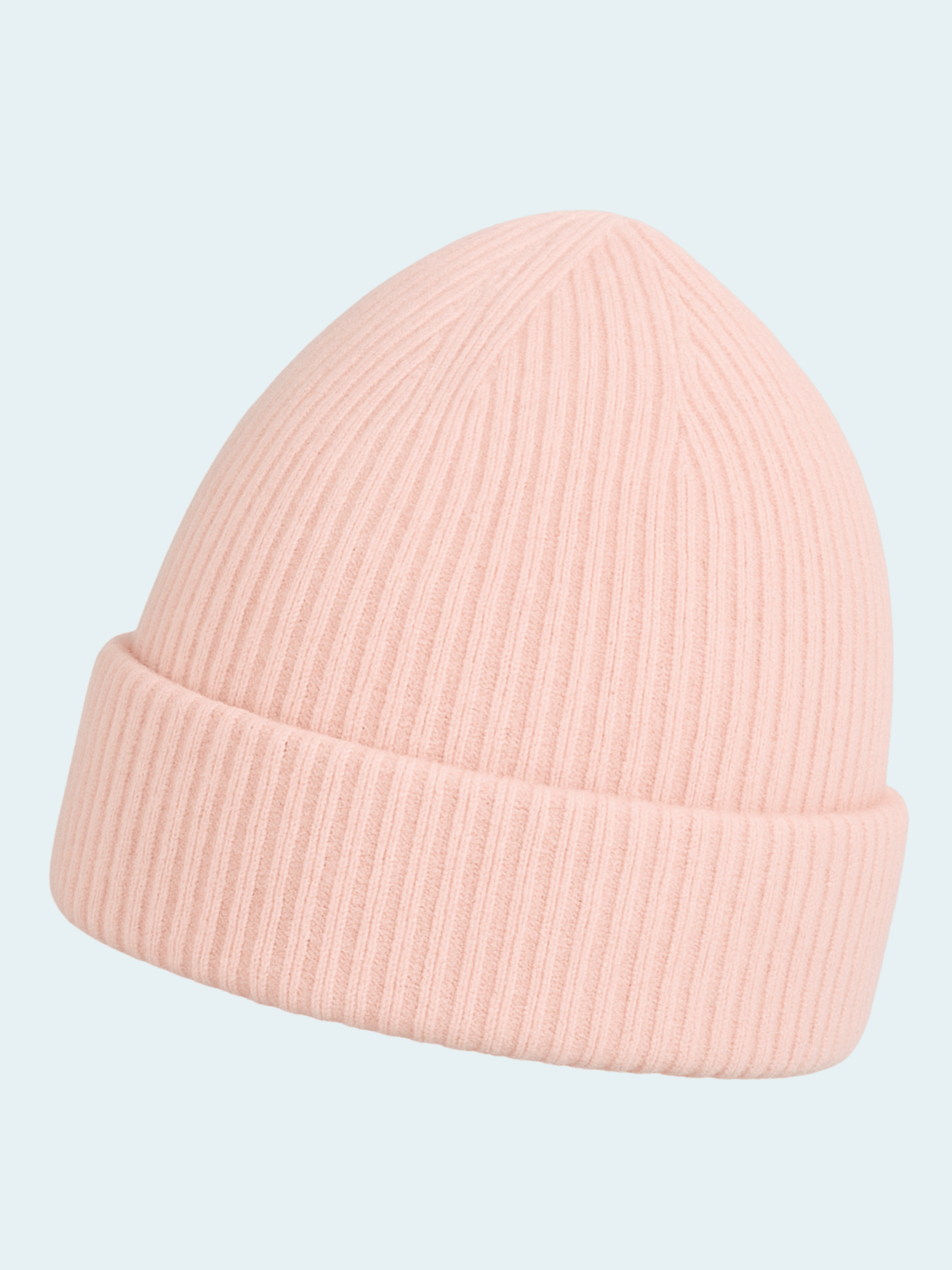 Pink beanie hat on a light blue background