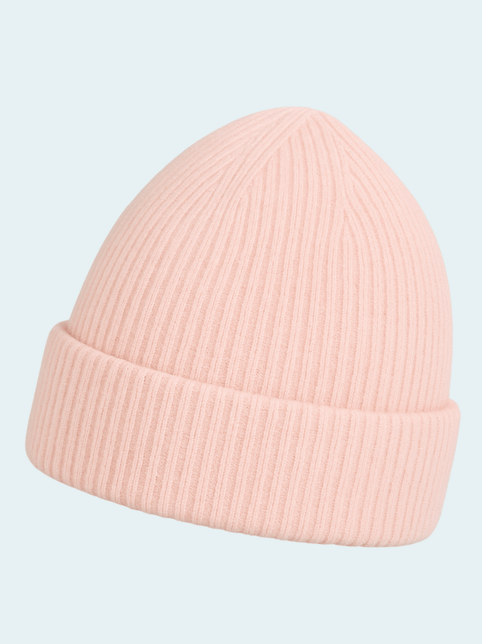 Pink beanie hat on a light blue background