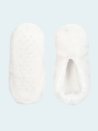 Pair of white slipper socks on a light blue background