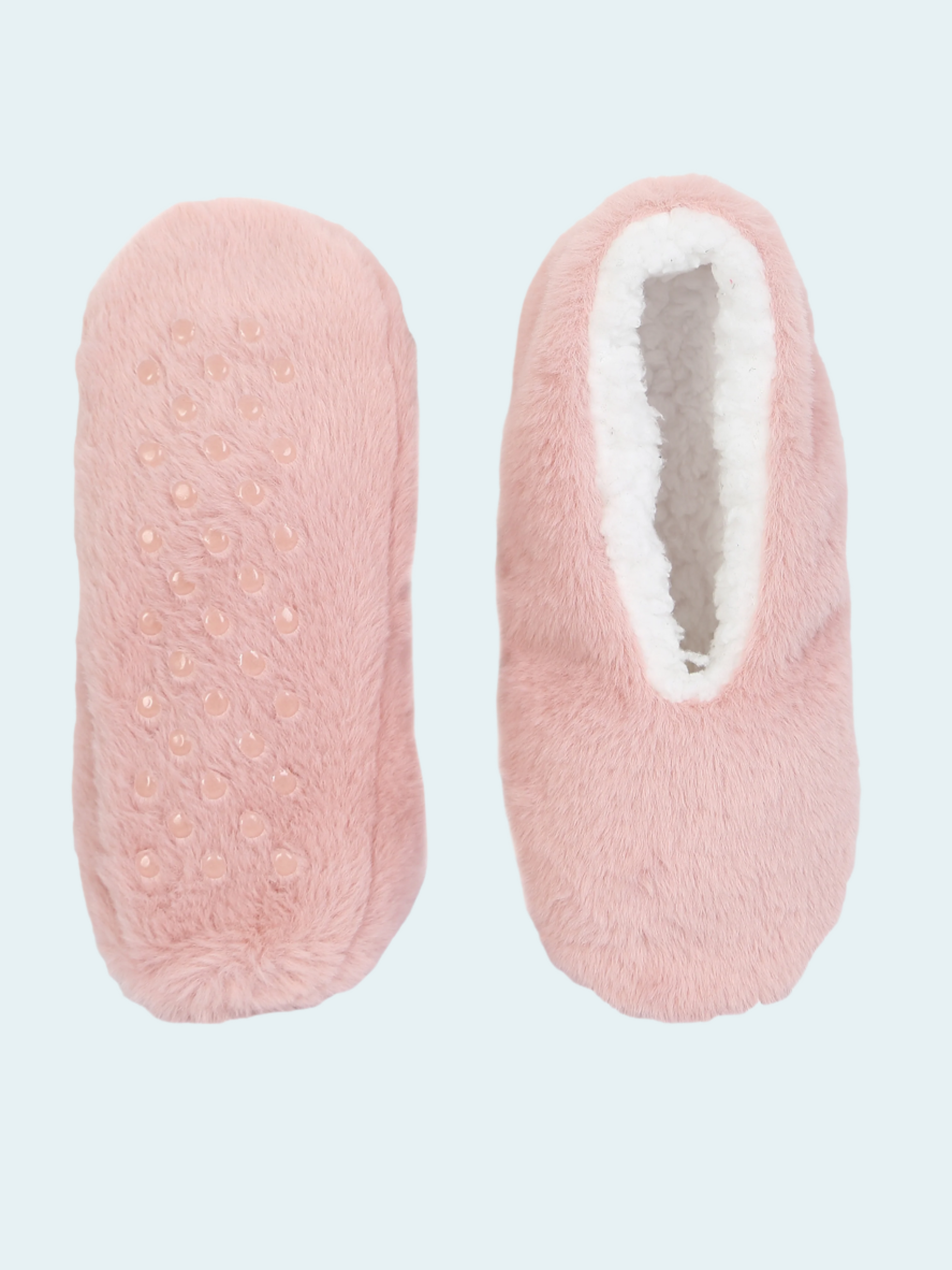 Pair of pink slipper socks with textured surface and white interior on a light gray background