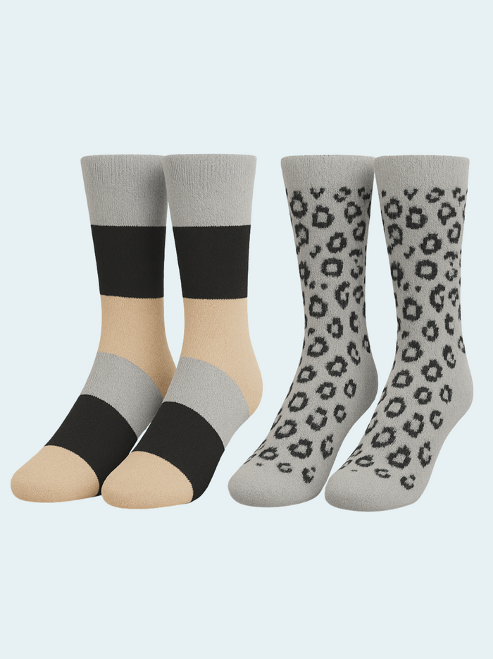 Two pairs of socks with black, beige, and gray color scheme on a light blue background.