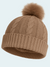 Brown knit beanie with a pom-pom on a light gray background